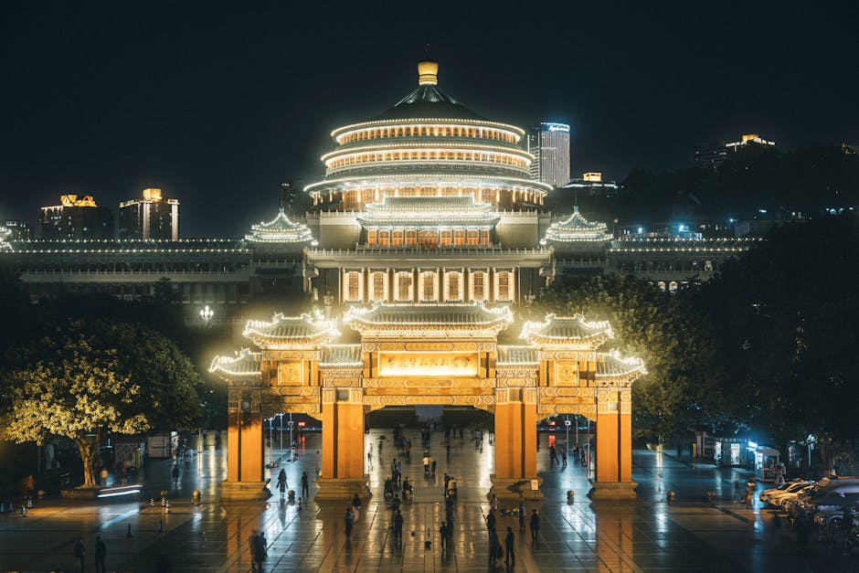 Night view of the Great Hall of the People in Chongqing, China, beautifully illuminated.