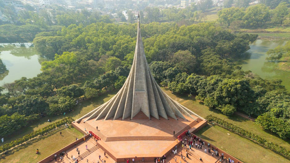 Breathtaking aerial view of the iconic Jatiyo Smriti Soudho in Savar, surrounded by lush landscapes.