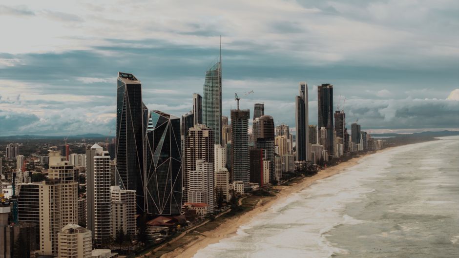 Aerial shot of Gold Coast's skyline with modern skyscrapers along the coastline.