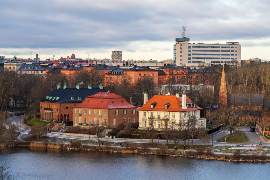 A picturesque view of Stockholm's historic architecture by the waterfront in winter.