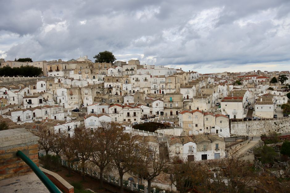 A panoramic view of the charming whitewashed architecture in Monte Sant'Angelo, Puglia, Italy.